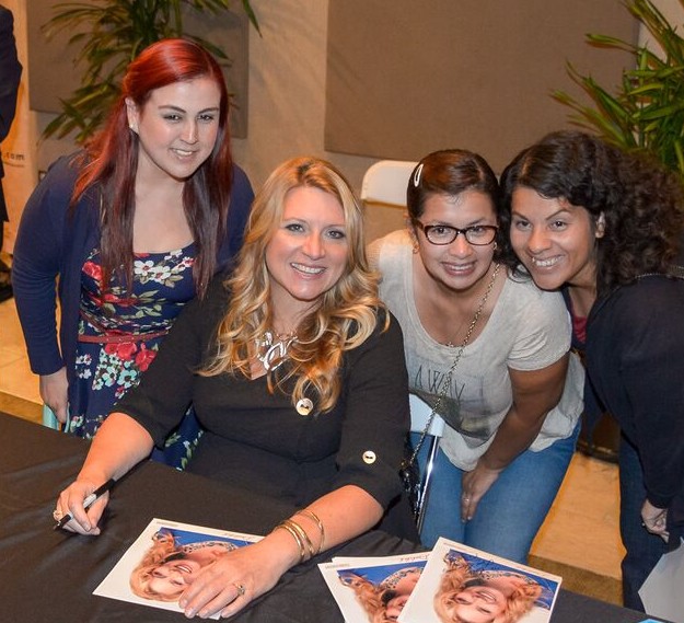 Delilah signing with fans.jpg